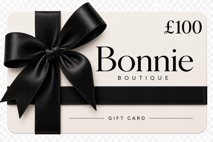 A Bonnie Boutique gift card valued at £250, featuring a large black satin ribbon bow on the left side and a black horizontal ribbon across the lower half, set against a light cream background.